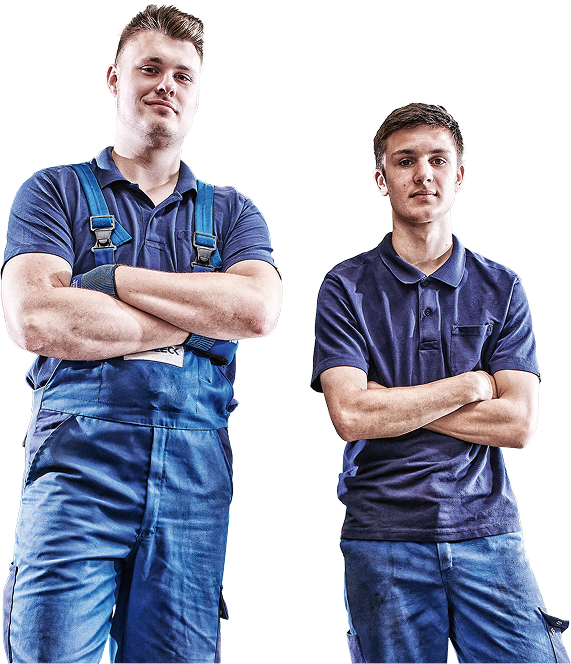 Two men in work clothes with their arms crossed.