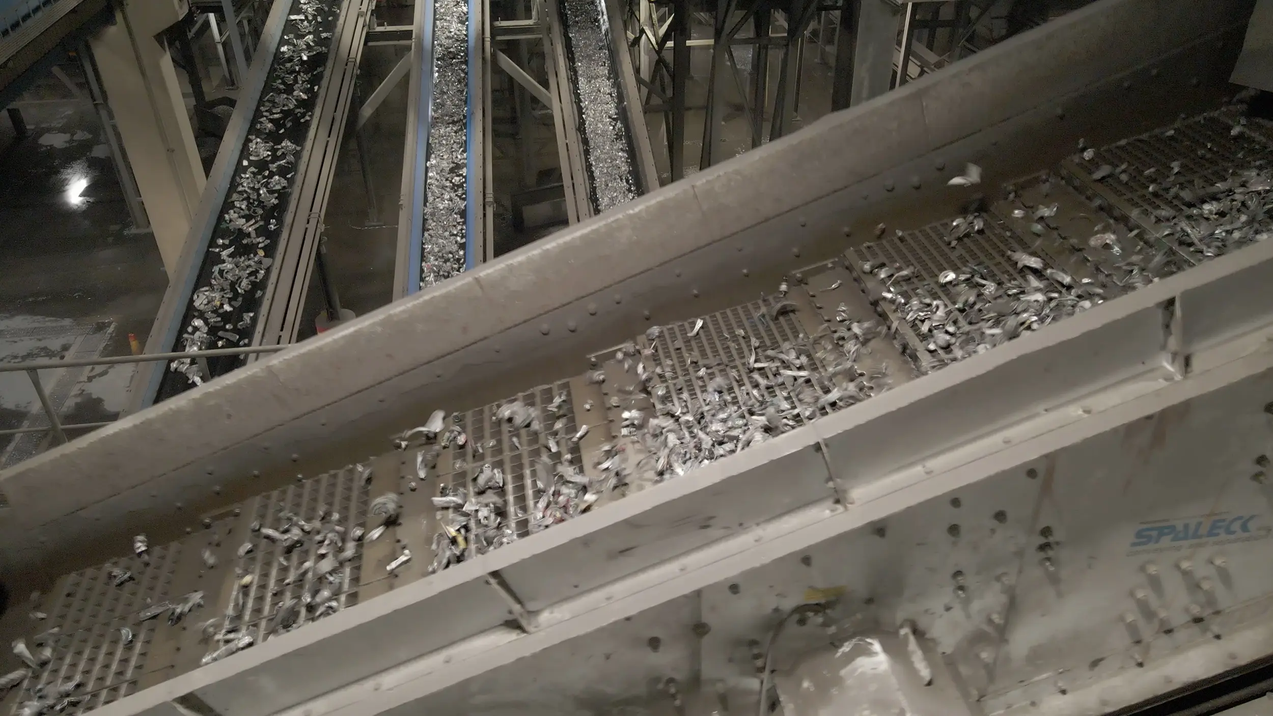 Industrial plant with a recycling screen for material sorting.