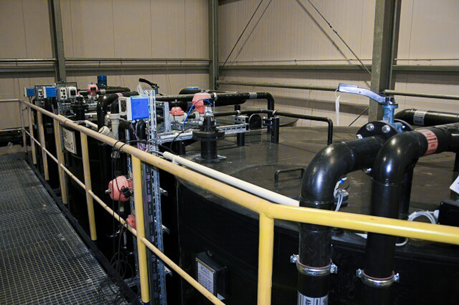 Black tanks for precipitation and flocculation in industrial water treatment