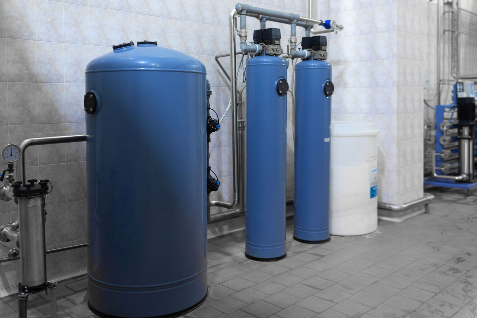 Blue tanks for ion exchange in water treatment.